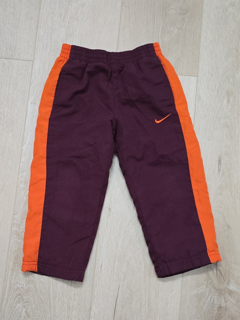 Nike Kids Burgundy Pants with Orange Side Stripes